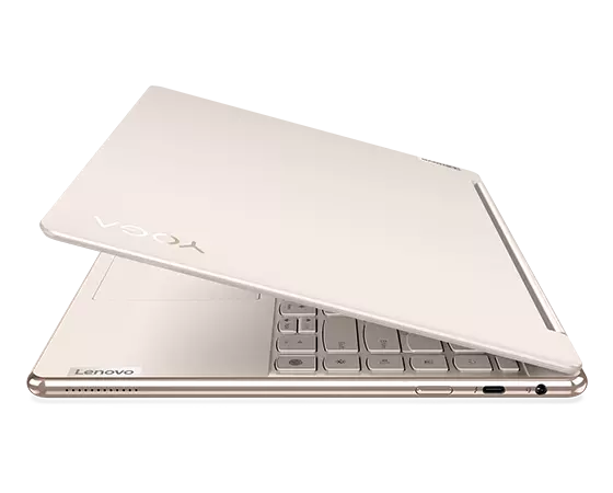 Right-side-facing Yoga 9i Gen 8 2-in-1 laptop, Oatmeal color, opened at 45 degrees, showing part of keyboard, top cover. & right-side ports