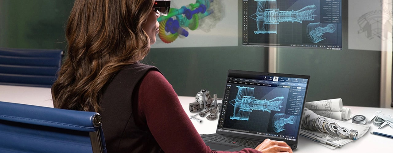Industrial designer at work, wearing 3D glasses and using a Lenovo ThinkPad P1 Gen 6 (16″ Intel) mobile workstation, looking at a car design on the display