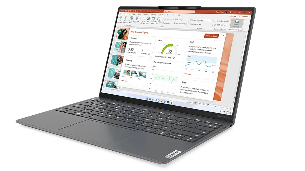 Yoga Slim 7i Carbon laptop at an angle, opened, showing keyboard, trackpad, display with PowerPoint presentation, & right-side ports