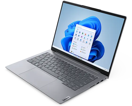 Overhead shot of Lenovo ThinkBook 14 Gen 6 laptop showing display with Windows 11 Start menu, keyboard, & right-side ports & slots.
