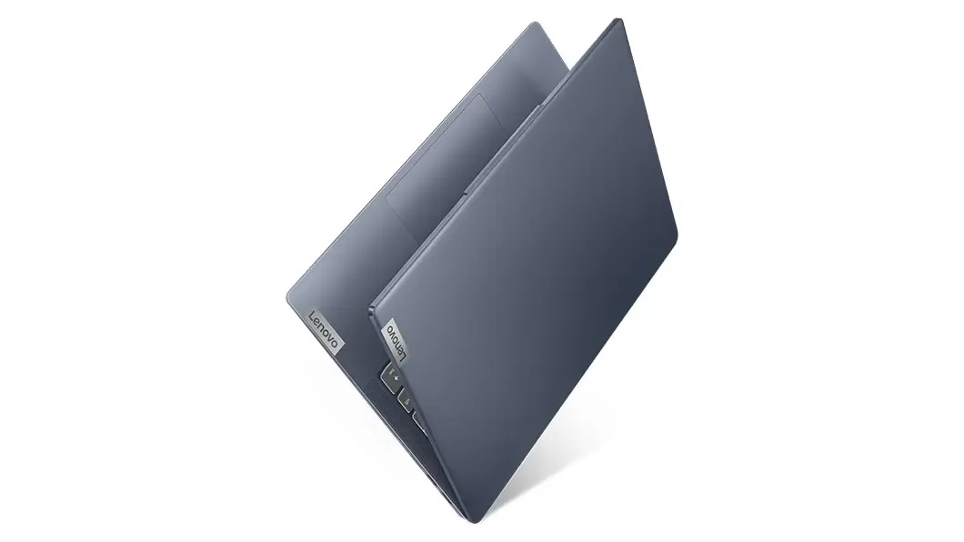 Front-left facing angled view of almost closed 14-inch Lenovo IdeaPad Slim 5 AMD showing Lenovo logos on cover and palm rest.