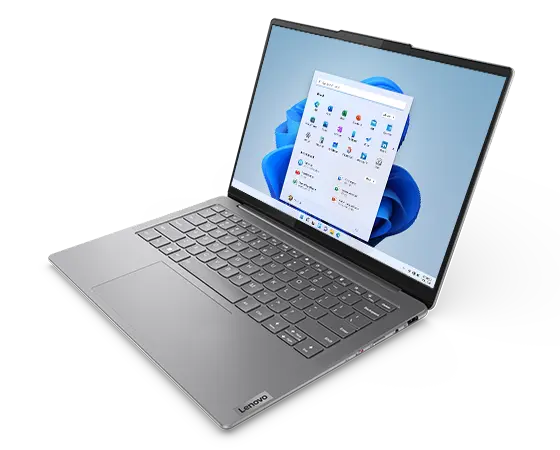 Open Luna Grey Yoga Slim 7i Gen 9 laptop with OLED display facing left