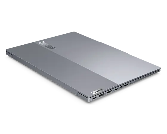 Side view of Lenovo ThinkBook 14 Gen 6+ (14 inch Intel) laptop, closed, at slight angle, showing top cover & right-side ports