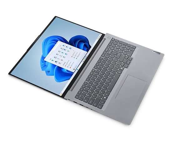Overhead shot of the Lenovo ThinkBook 16 Gen 7 laptop display & keyboard, open 180 degrees with lay-flat hinge.