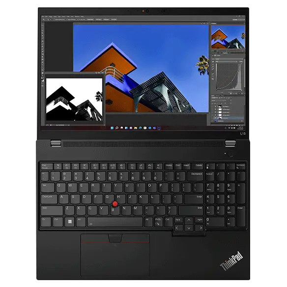 Lenovo ThinkPad L15 Gen 4 (15” Intel) laptop—front-left view, lid open, with screensaver image on the display showing desert scene at night with red motion graphics superimposed