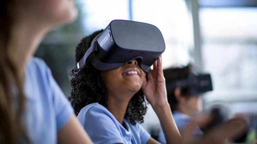 A young student using a Lenovo VR Classroom headset