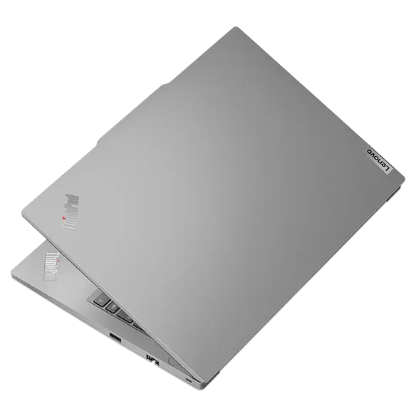 Rear side view of Lenovo ThinkPad E14 Gen 4 (14” Intel) laptop,  opened slightly, showing top cover and part of keyboard