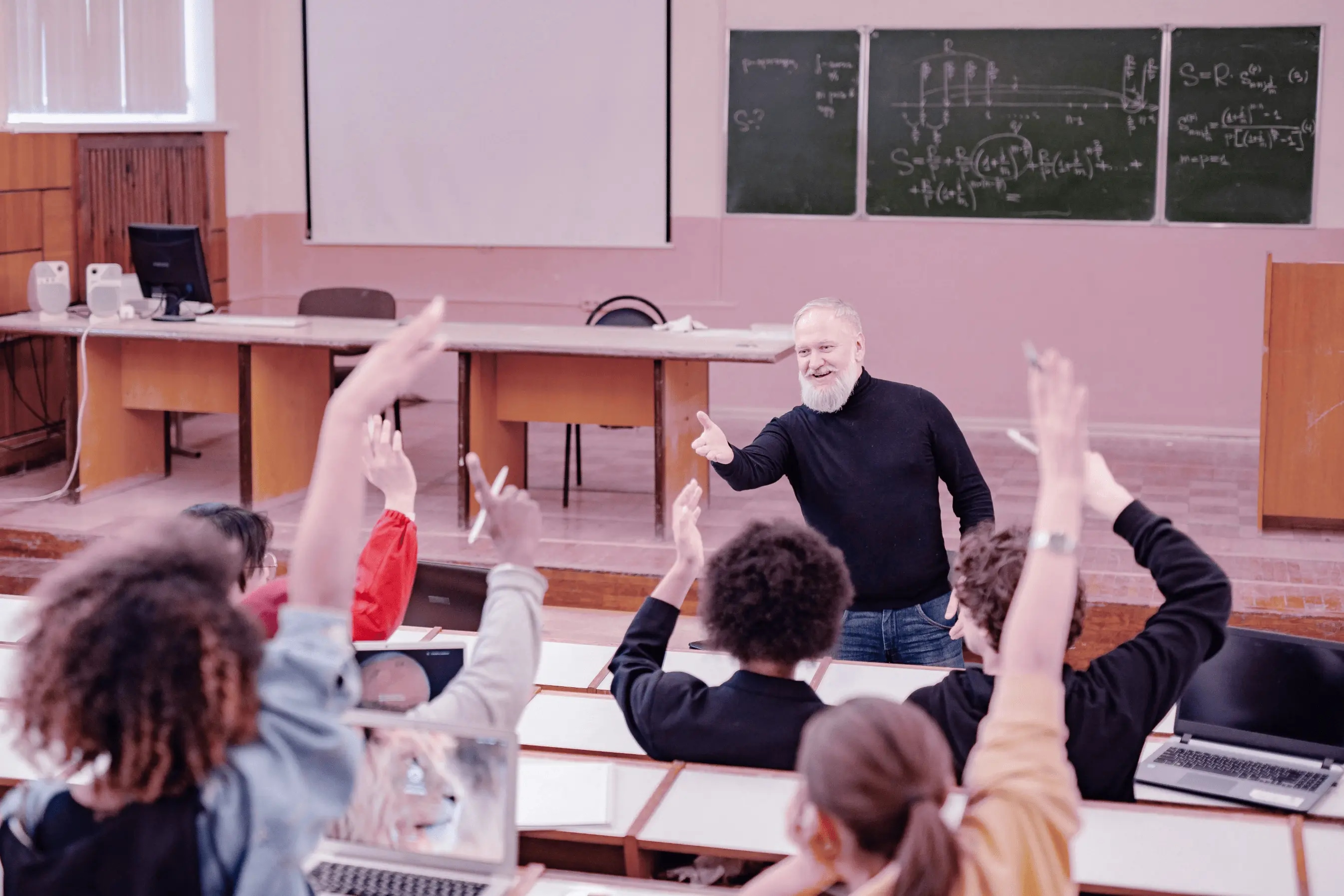 Students conferring together over table
