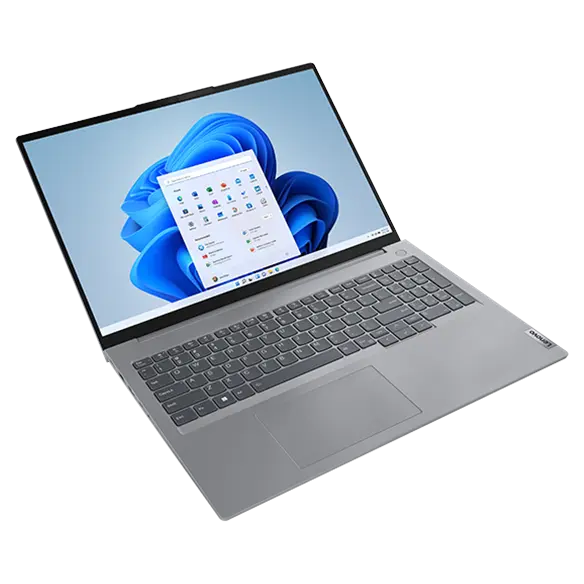 Overhead shot of the Lenovo ThinkBook 16 Gen 6 laptop floating, with focus on Windows 11 display & keyboard. 