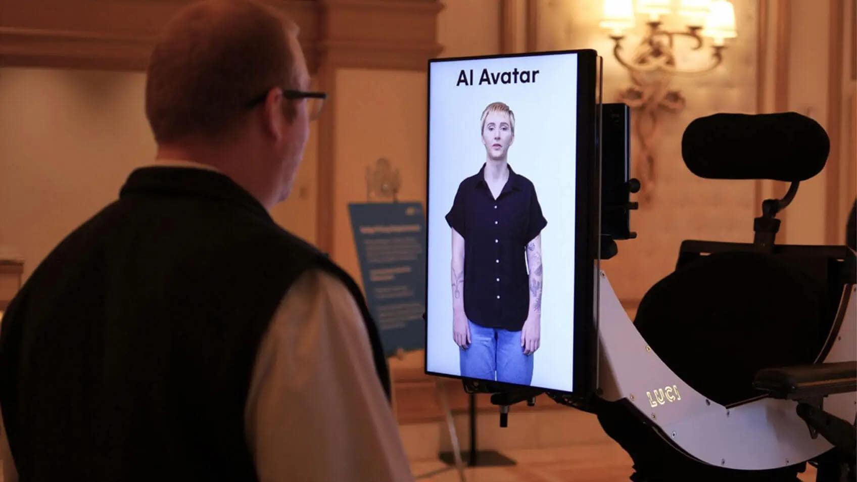 A man looking at a screen of his AI-generated avatar