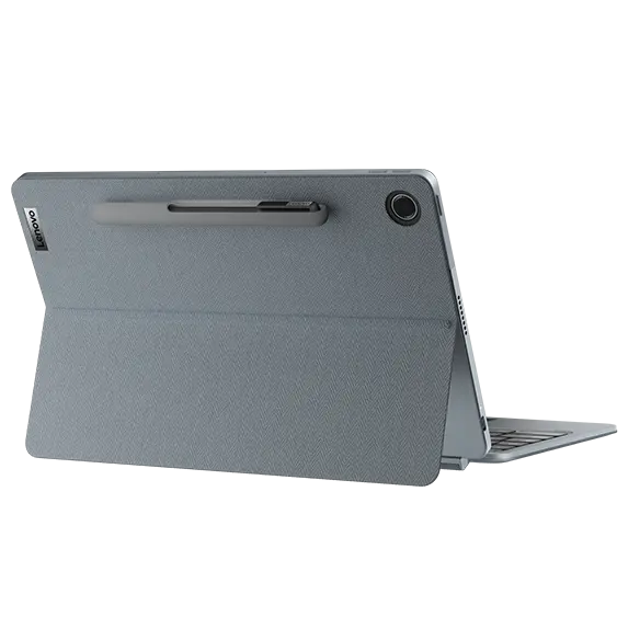 Rear view of the Lenovo IdeaPad Duet 3 Chromebook (11" QCOM) in an open position. The back of the device features a fabric-textured cover, a stylus attached at the top, and a rear camera. The device is supported by its kickstand.