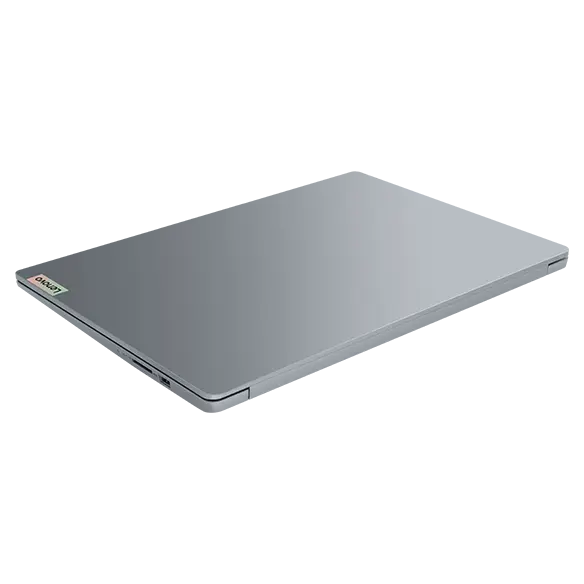 Rear, right side view of the Lenovo IdeaPad Slim 3i Gen 9 16 inch laptop in Abyss Blue with lid closed & visible Lenovo logo on the top cover.