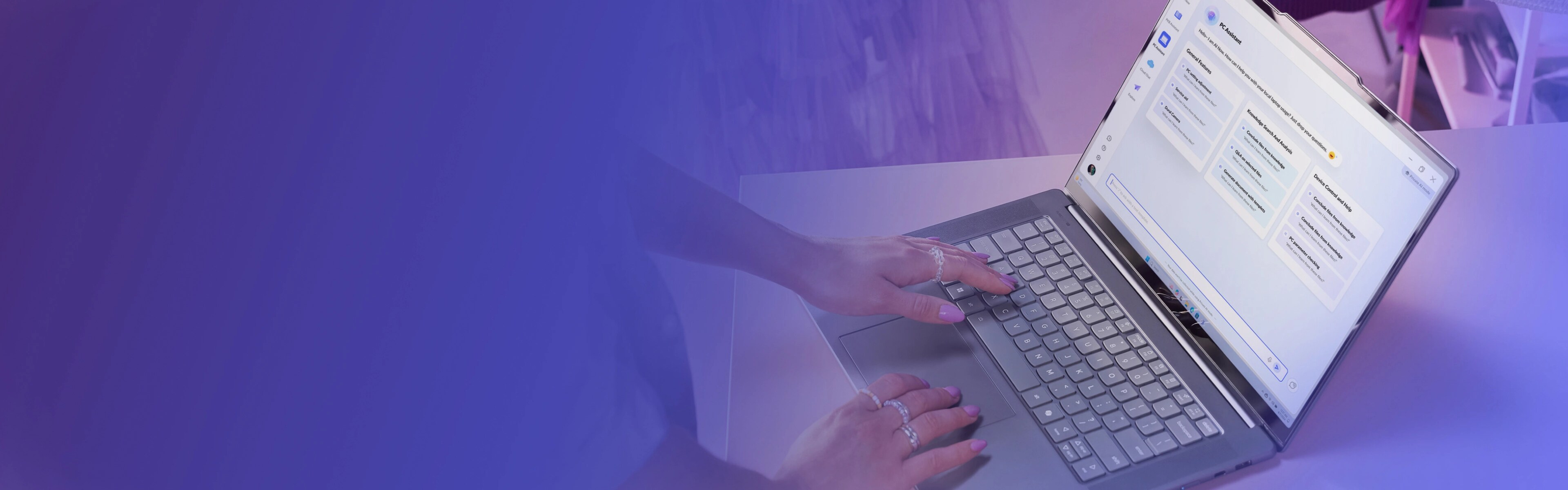 A woman wearing lots of rings that’s typing on her laptop