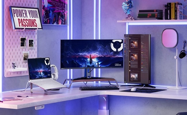 Gaming and streaming desk setup with Legion 7i Gen 10, wide monitor, and vertical display.