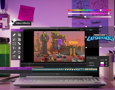 The Lenovo LOQ Essential 15ARP10 gaming laptop on a desk with a Minecraft Legends interface on the display and video effect control elements hovering in front of it. מחשב נייד LOQ&nbsp;15ARP10E 83S0005HIV&nbsp;מבית&nbsp;Lenovo