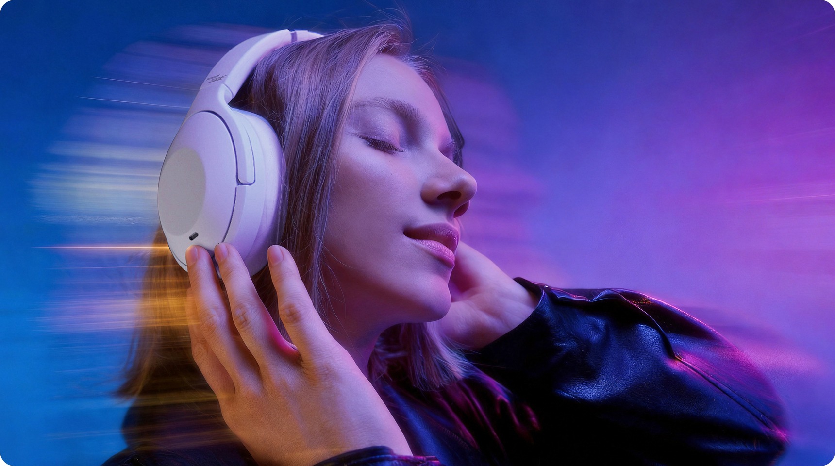 Woman wearing white over-ear headphones, eyes closed, against a blue-purple gradient background.