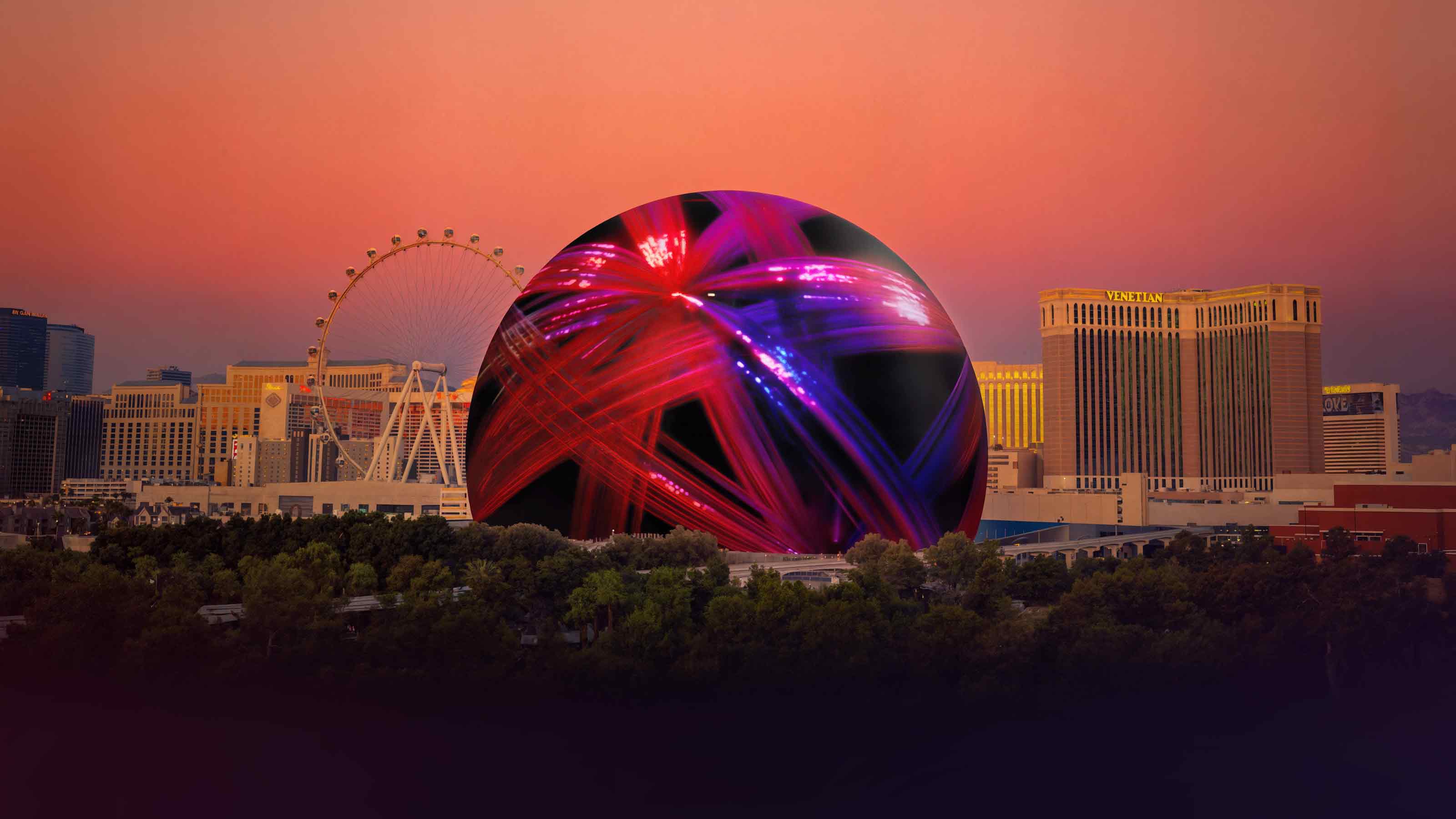 Las Vegas skyline at sunset featuring the illuminated Sphere with vibrant red and purple light patterns.