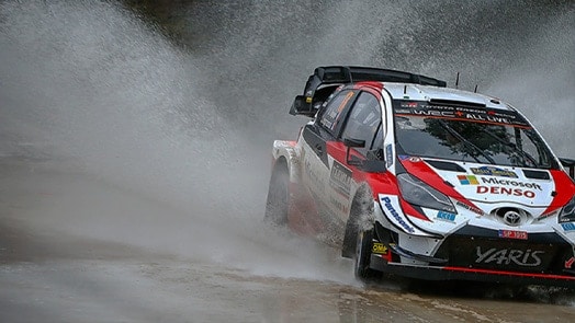 Toyota race car on a wet track