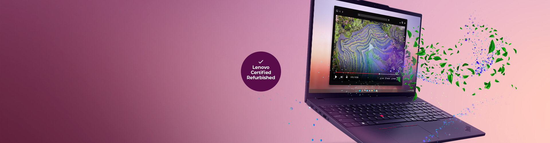 A collection of four laptops arranged in an artistic layout against a deep red background