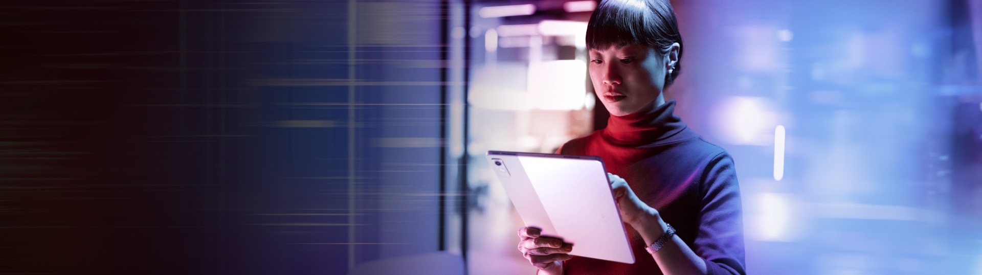 Woman holding a tablet with servers in the background.