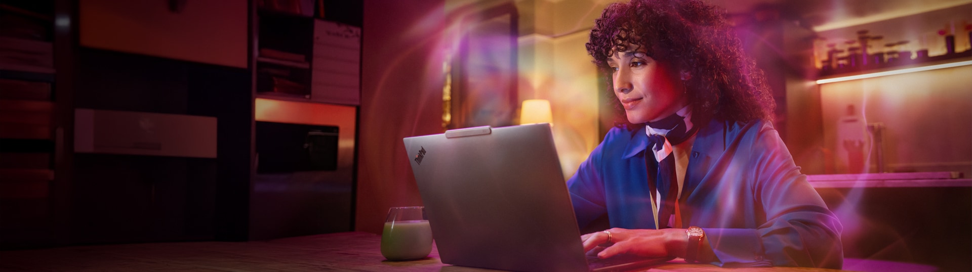 Lenovo ThinkPad X9 14-inch Aura Edition laptop displayed on a sleek modern desk setup, showcasing its slim design and premium finish.