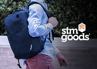 A guy is carrying his STM backpack outside.