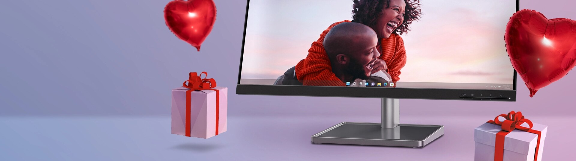 Lenovo monitor showing a picture of a happy couple with a sunset sky with a birthday celebration background
