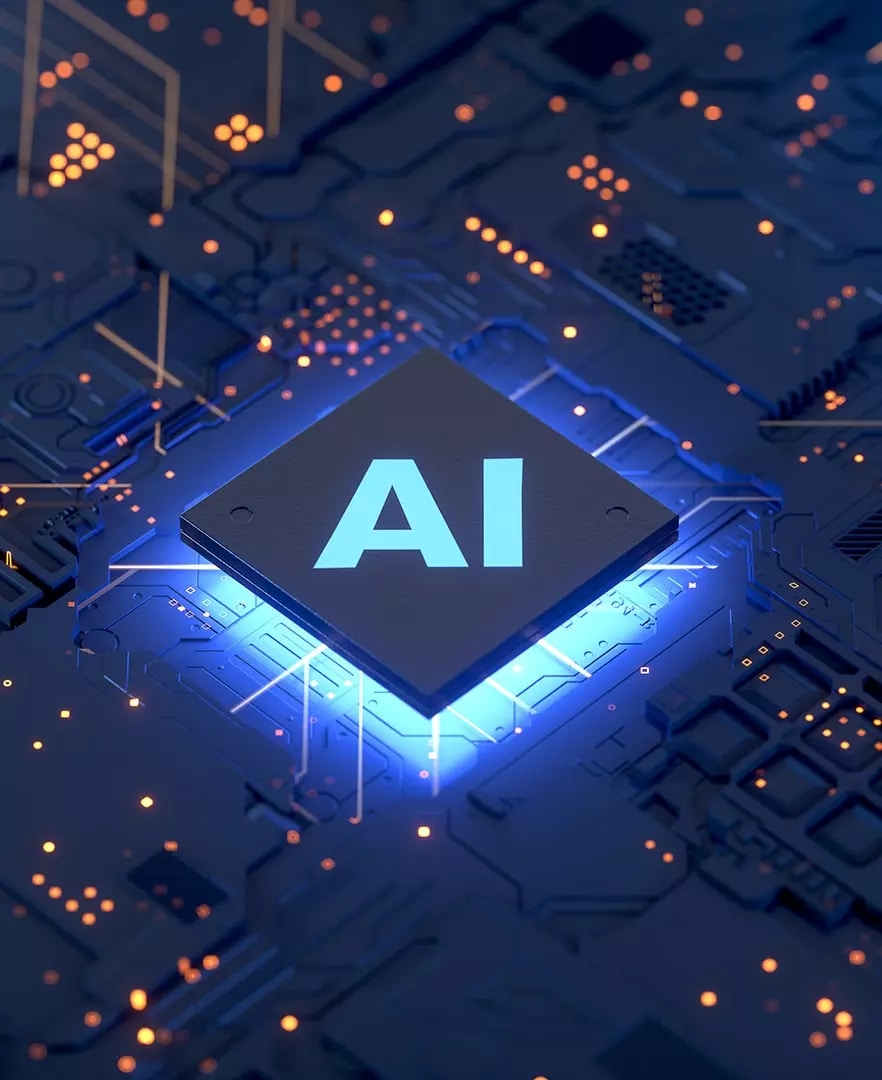 Close up of tech components lit up with focal point labeled AI. 