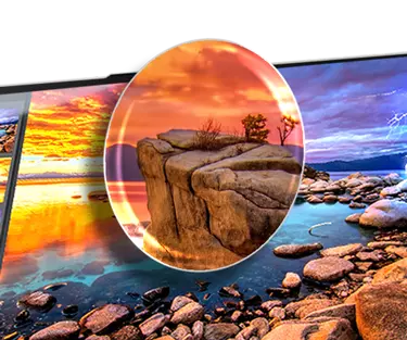 Lenovo laptop opened, screen showing a close-up of coast-line rocks