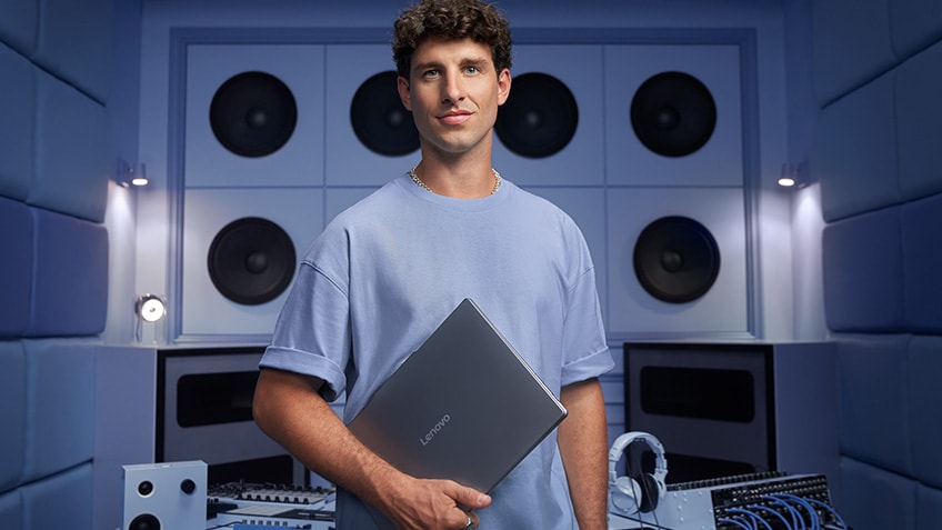 A man holding a laptop