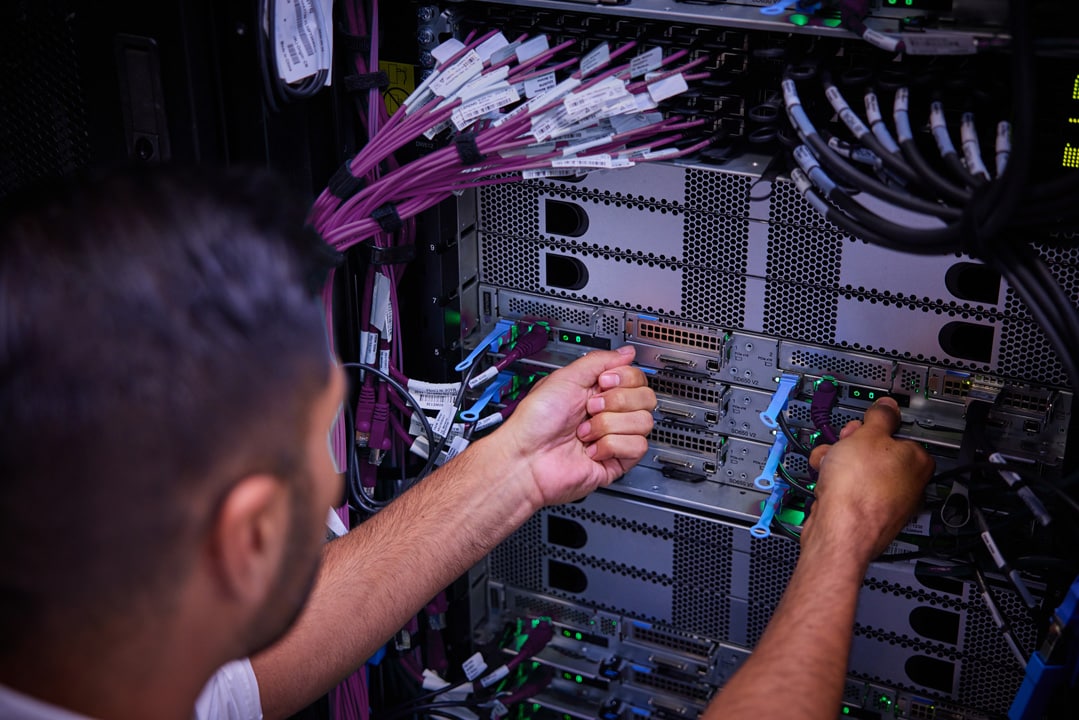 A man examining servers