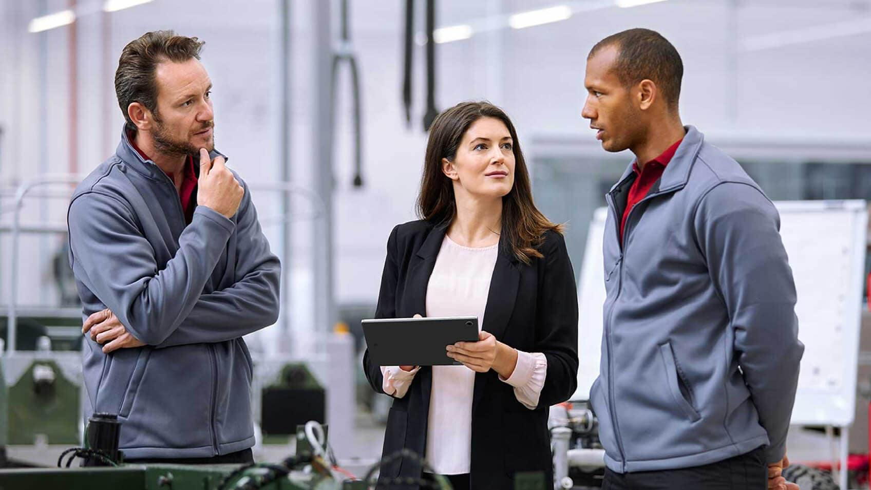 Three colleagues having a conversation