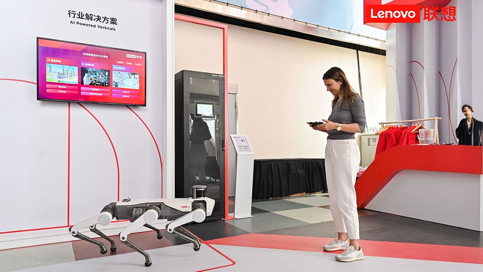 A woman controlling a six-legged robot.