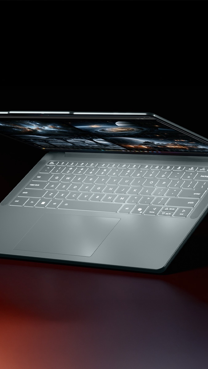 Una laptop Lenovo IdeaPad Vibe, con la tapa parcialmente abierta, que muestra el teclado retroiluminado. 