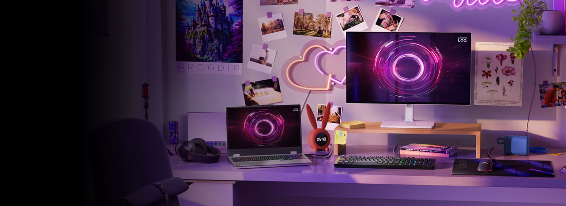 A desk that looks like it belongs to a young person set up with many Lenovo LOQ devices and accessories.