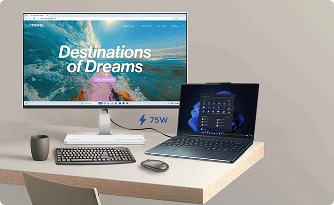 A laptop is connected to the monitor, showcasing a powerful USB-C connectivity.