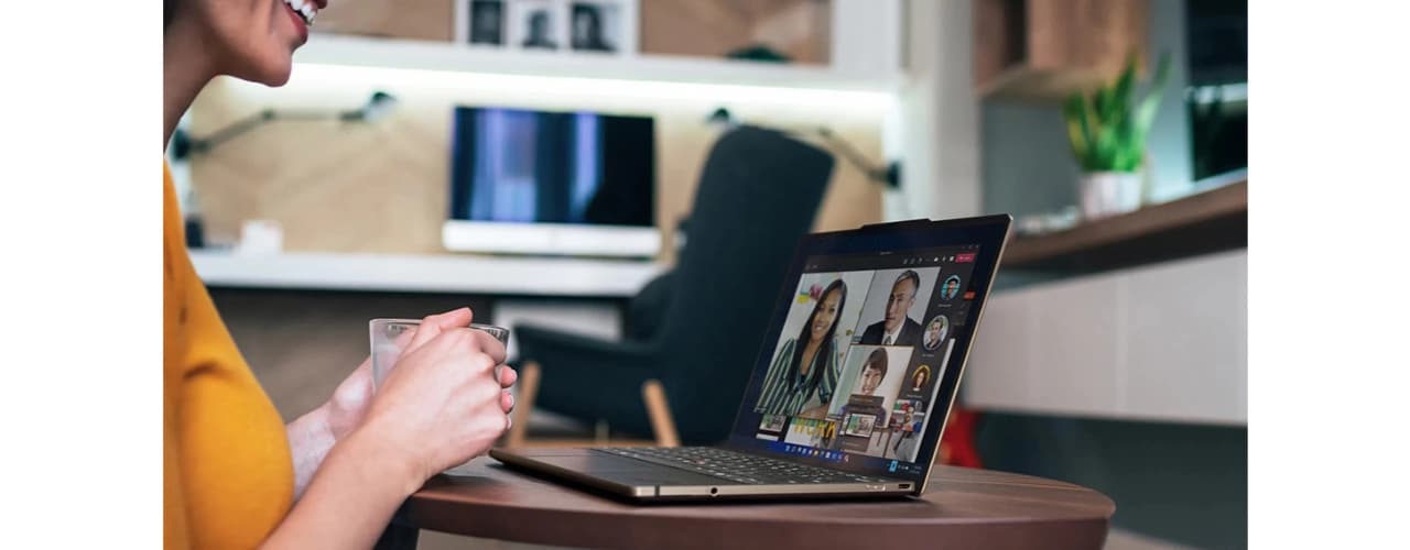 Lenovo ThinkPad Z13 laptop on a table with person using it for conference call