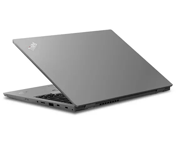 Silver laptop half-closed, revealing ThinkPad logo and part of keyboard