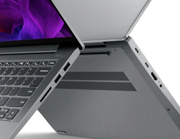 Three quarter side view crop of two Lenovo IdeaPad 5 Gen 7 laptop PCs forming ‘X’ shape in space, showing ports.