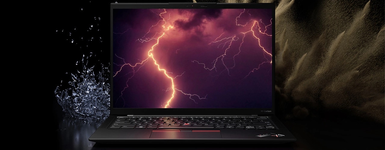 Lenovo ThinkPad X1 Carbon Gen 11 laptop surrounded by the elements of spilling water and desert dust, with lightning on the display to suggest MIL-SPEC testing.